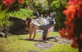 Fit girl doing kickback exercise for glutes with resistance band. Fitness woman working out donkey kick. Royalty Free Stock Photo