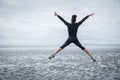 Fit girl leaping on cold day