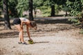 Fit girl playing rugby ball outdoors, having fun exercising in a park under sunny sky. Royalty Free Stock Photo