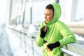 Fit girl resting after exercise on snow Royalty Free Stock Photo