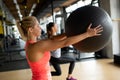 Fit girl workout with fitness ball in gym. Sport helath fitness lifestyle concept Royalty Free Stock Photo