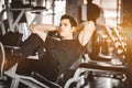 Fit handsome caucasian man sit up on machine in sportswear. Young man sit up exercise to strengthen Royalty Free Stock Photo