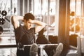 Fit handsome caucasian man sit up on machine in sportswear. Young man sit up exercise Royalty Free Stock Photo