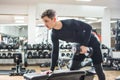 Fit handsome young man lifting weights in gym Royalty Free Stock Photo