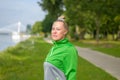 Fit healthy woman enjoying a jog along a river bank Royalty Free Stock Photo