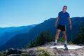 Fit male runner stretching his legs and getting ready for a long run  workout  early in the morning on a nice sunny day Royalty Free Stock Photo