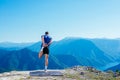 Fit male runner stretching his legs and getting ready for a long run  workout  early in the morning on a nice sunny day Royalty Free Stock Photo