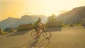 Fit male tourist riding his road bike in the scenic mountains on sunny morning. Royalty Free Stock Photo