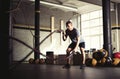 Man with battle ropes in gym Royalty Free Stock Photo