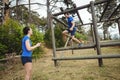 Fit man climbing monkey bars Royalty Free Stock Photo