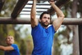 Fit man climbing monkey bars Royalty Free Stock Photo