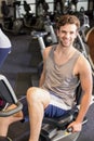 Fit man doing exercise bike Royalty Free Stock Photo