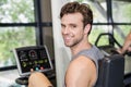 Fit man doing exercise bike Royalty Free Stock Photo