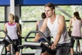 Fit man doing exercise bike Royalty Free Stock Photo