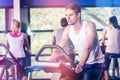 Fit man doing exercise bike Royalty Free Stock Photo