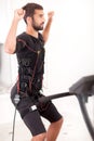 Fit man exercise on electro muscular stimulation machine Royalty Free Stock Photo