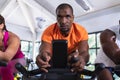 Fit man exercising on exercise bike in fitness center