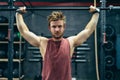 Fit man lifting a barbell in a gym Royalty Free Stock Photo