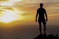 Fit man looking into the sun Royalty Free Stock Photo
