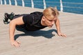 Fit man pushing up on pier Royalty Free Stock Photo