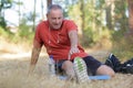 fit man stretching legs outdoors doing forward lunge Royalty Free Stock Photo