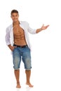 Fit Man In Unbuttoned Shirt Presenting Something Royalty Free Stock Photo