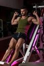 Fit Man Using The Leg Press Machine At A Health Club Royalty Free Stock Photo