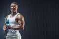 Fit man at workout in gym with shaker Royalty Free Stock Photo