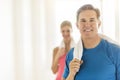 Fit Mature Woman Holding Towel With Woman In Background