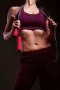 Fit mature woman with skipping rope Royalty Free Stock Photo