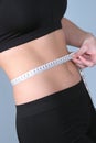 Fit - measuring waist with metric Royalty Free Stock Photo