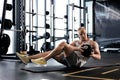 Fit and muscular man exercising with medicine ball at gym. Royalty Free Stock Photo