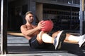 Fit and muscular man exercising with medicine ball at gym Royalty Free Stock Photo