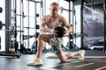 Fit and muscular man exercising with medicine ball at gym. Royalty Free Stock Photo