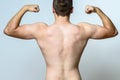 Fit muscular young man flexing his muscles Royalty Free Stock Photo