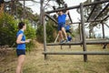 Fit people climbing monkey bars Royalty Free Stock Photo