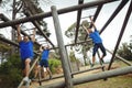 Fit people climbing monkey bars Royalty Free Stock Photo