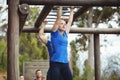 Fit people climbing monkey bars Royalty Free Stock Photo