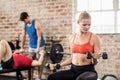 Fit people do some weightlifting together Royalty Free Stock Photo