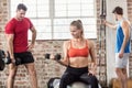 Fit people do some weightlifting together Royalty Free Stock Photo