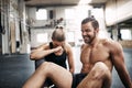 Fit people laughing while taking a break from working out Royalty Free Stock Photo