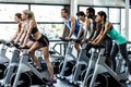 Fit people working out at spinning class Royalty Free Stock Photo