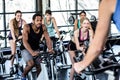 Fit people working out at spinning class Royalty Free Stock Photo