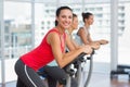 Fit people working out at spinning class Royalty Free Stock Photo