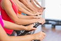 Fit people working out at spinning class Royalty Free Stock Photo