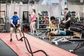 Fit people working out in weights room Royalty Free Stock Photo