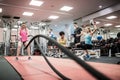 Fit people working out in weights room Royalty Free Stock Photo