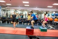 Fit people working out in weights room Royalty Free Stock Photo