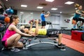 Fit people working out in weights room Royalty Free Stock Photo