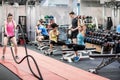 Fit people working out in weights room Royalty Free Stock Photo